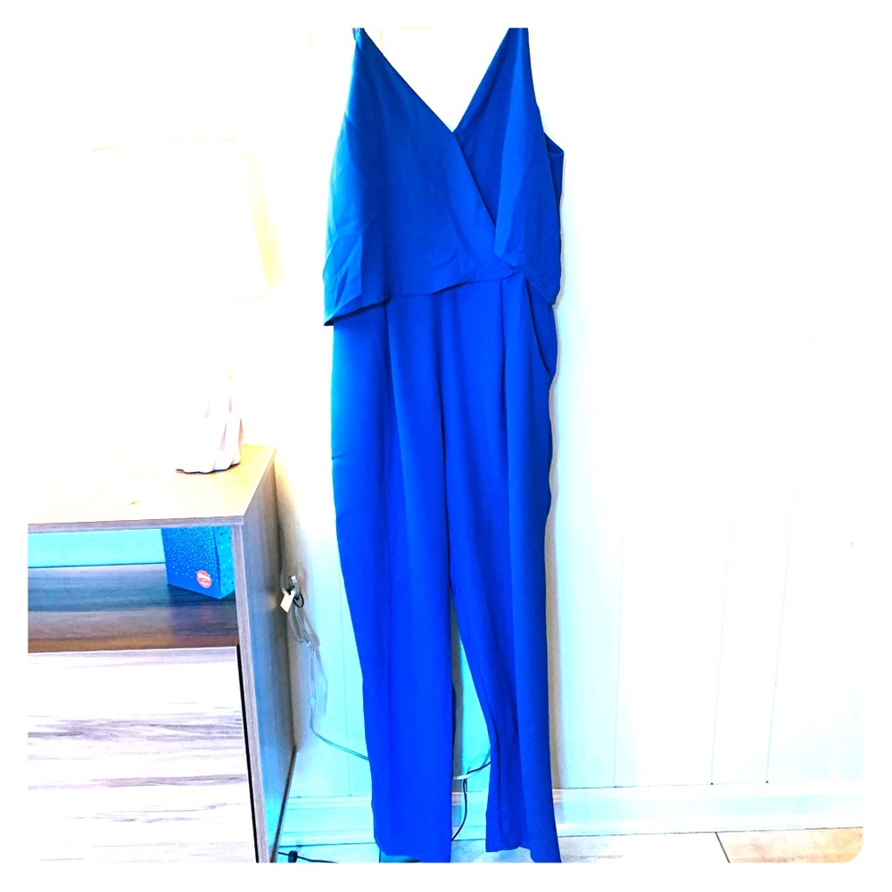 Blue jumpsuit with ruffled top, adjustable strap